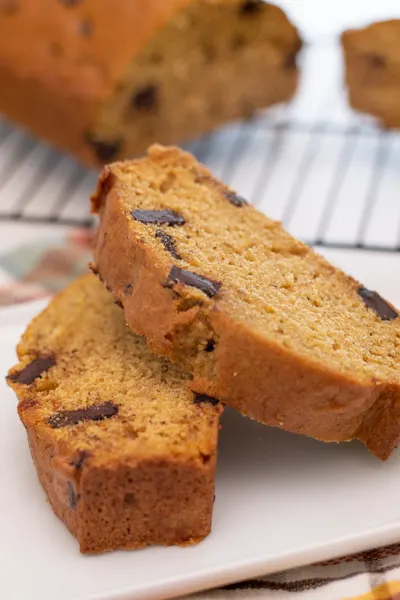 Chocolate Chunk Pumpkin Bread is a perfectly spiced homemade pumpkin bread with chocolate chunks. This simple bread is everyone’s favorite fall quick bread recipe! via @Mooreorlesscook