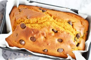 full loaf of 1 1/2 cups flour 1/2 teaspoon salt 1 cup sugar 1 teaspoon baking soda 1/2 teaspoon cinnamon 1/4 teaspoon freshly ground nutmeg 1/4 teaspoon allspice 1 cup canned pumpkin 1/2 cup butter, melted 2 eggs 1/4 cup milk 1 cup semi-sweet chocolate chunk chips