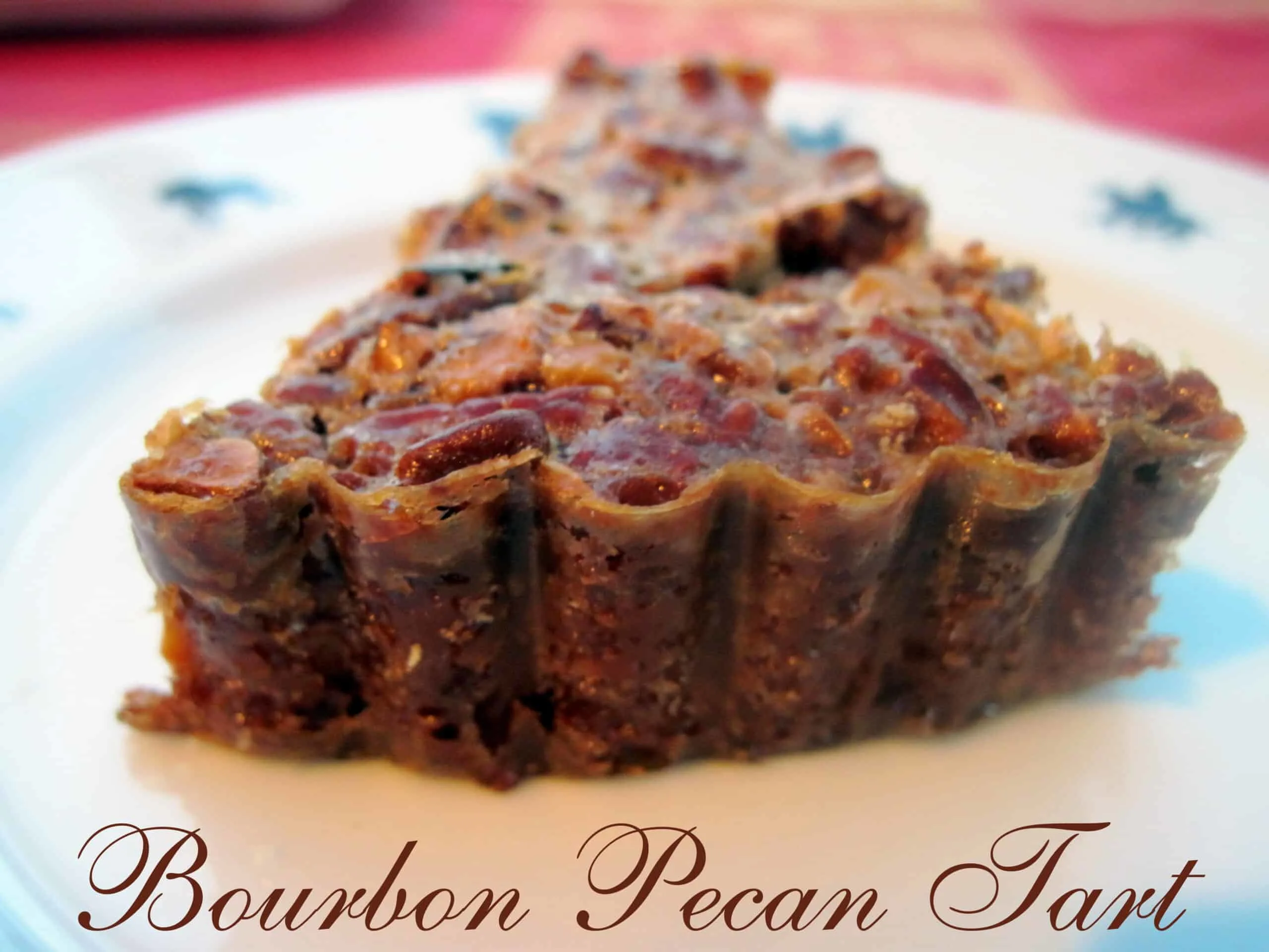 Best Pecan Bourbon Tart~ Heavenly and delicious Pecan Bourbon Tart. Simple ingredients make this tart a popular dessert for the holidays or any day. via @Mooreorlesscook