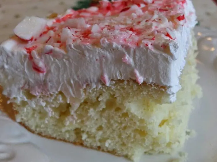 slice of white chocolate peppermint poke cake