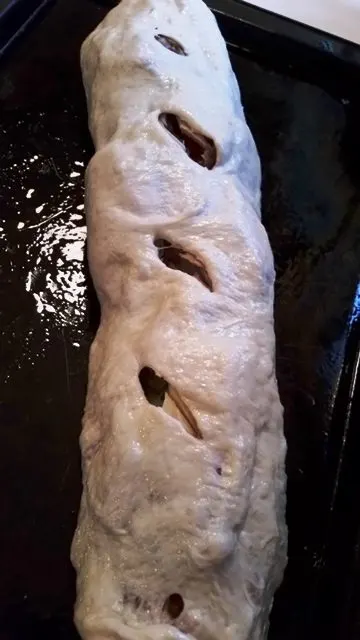Loaded Stromboli on a greased baking sheet