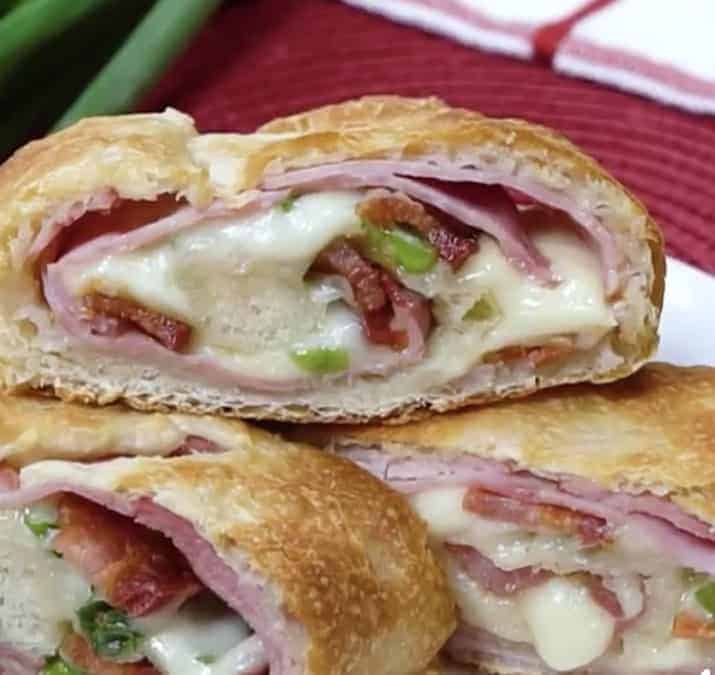 sliced stromboli filled with bacon ham and cheese