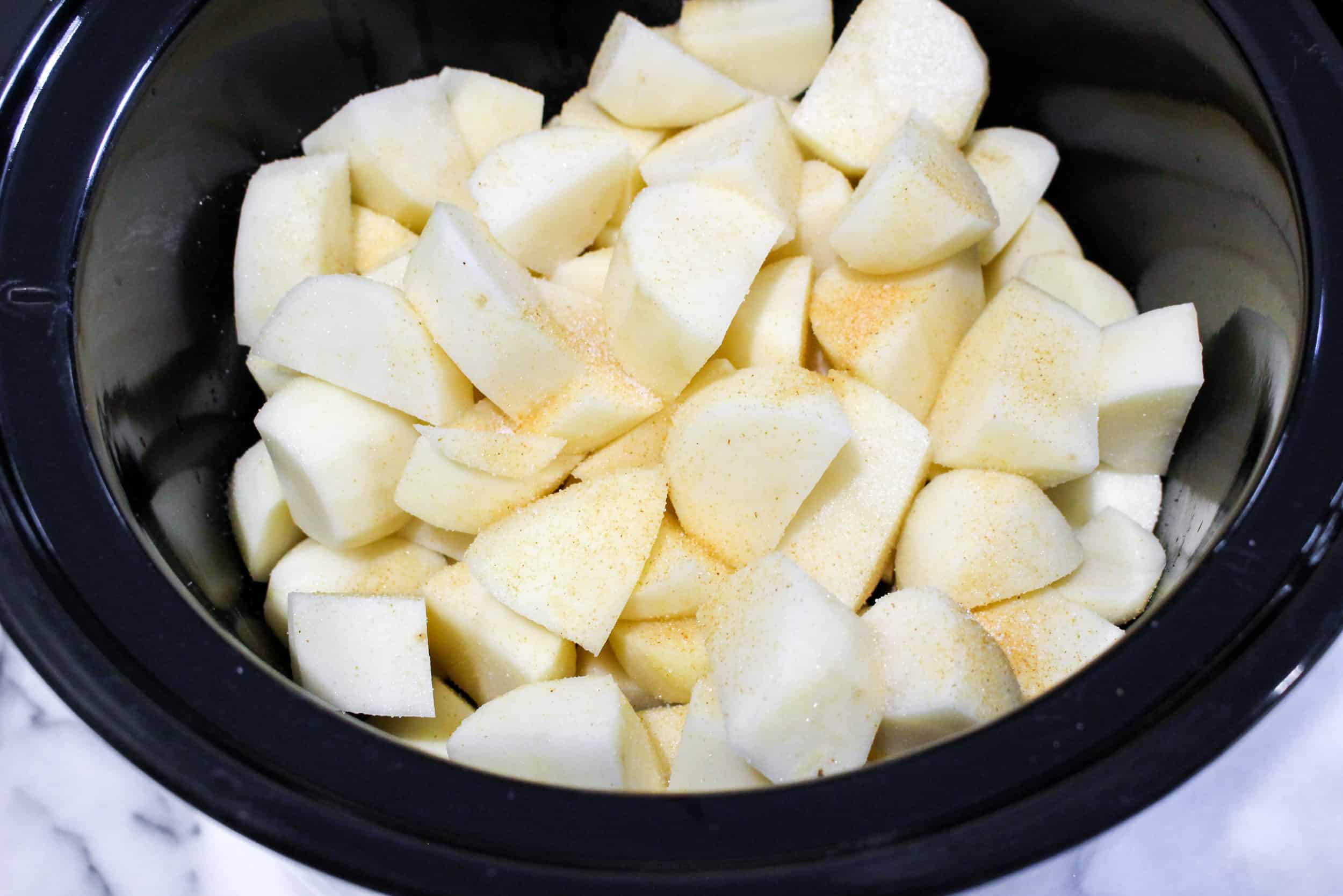 add potatoes and chicken broth to slow cooker