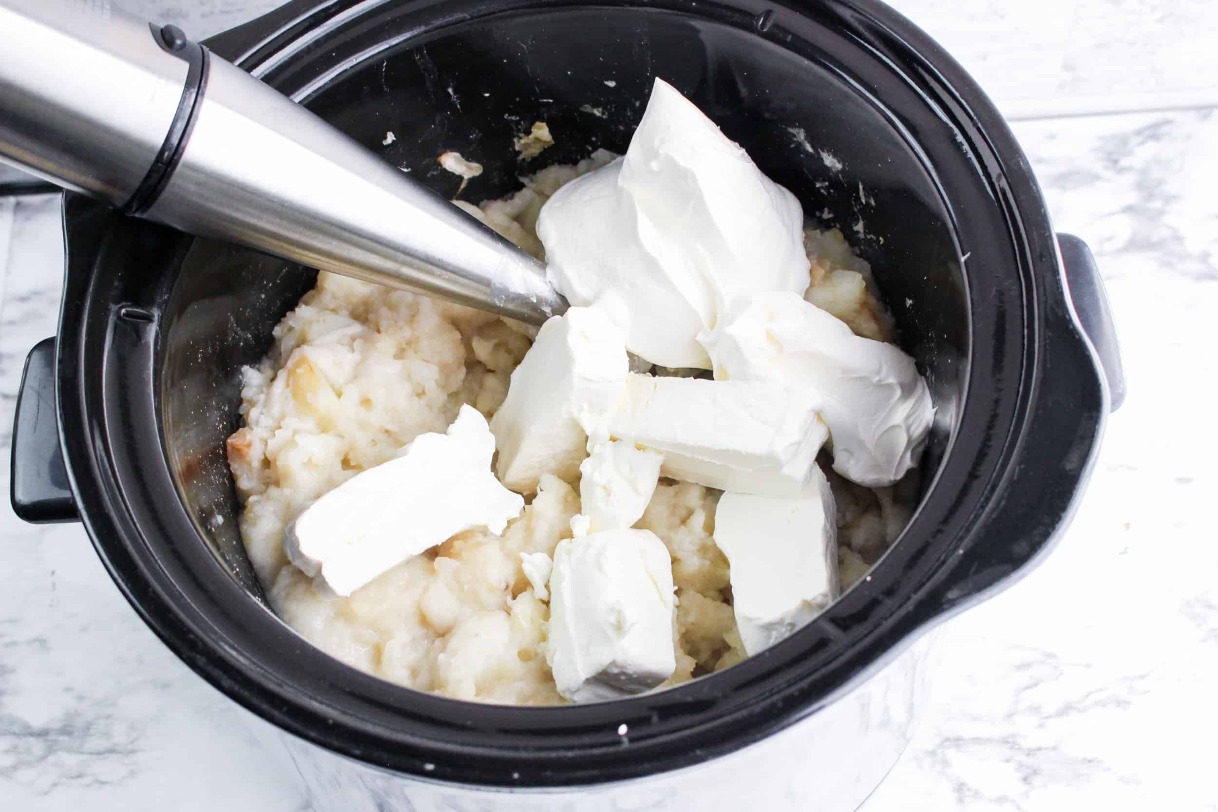 potatoes and cream cheese in slow cooker mix