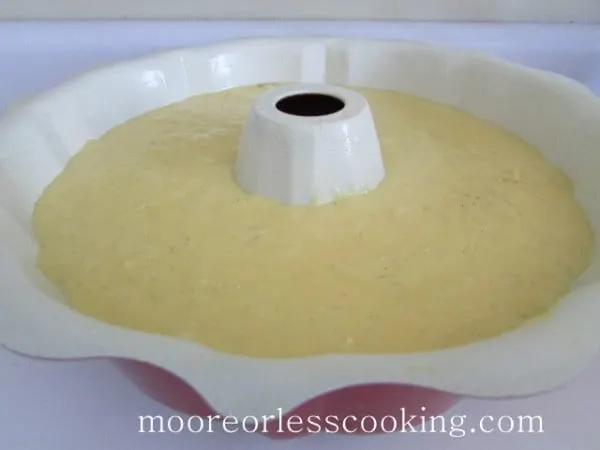 Pineapple Bundt Poke Cake batter in bundt pan