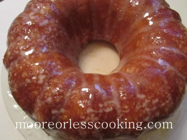 Pineapple Bundt Poke Cake, top view of cake glazed on white plate