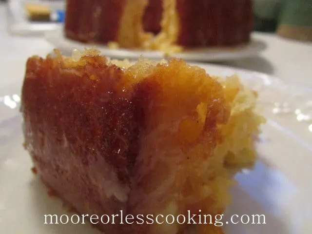 Pineapple Bundt Poke Cake, slice chunk of cake ready to serve