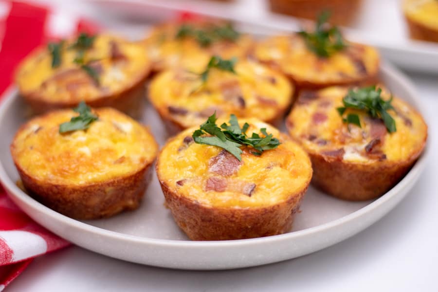 bacon and egg hash brown muffins served on a white platter