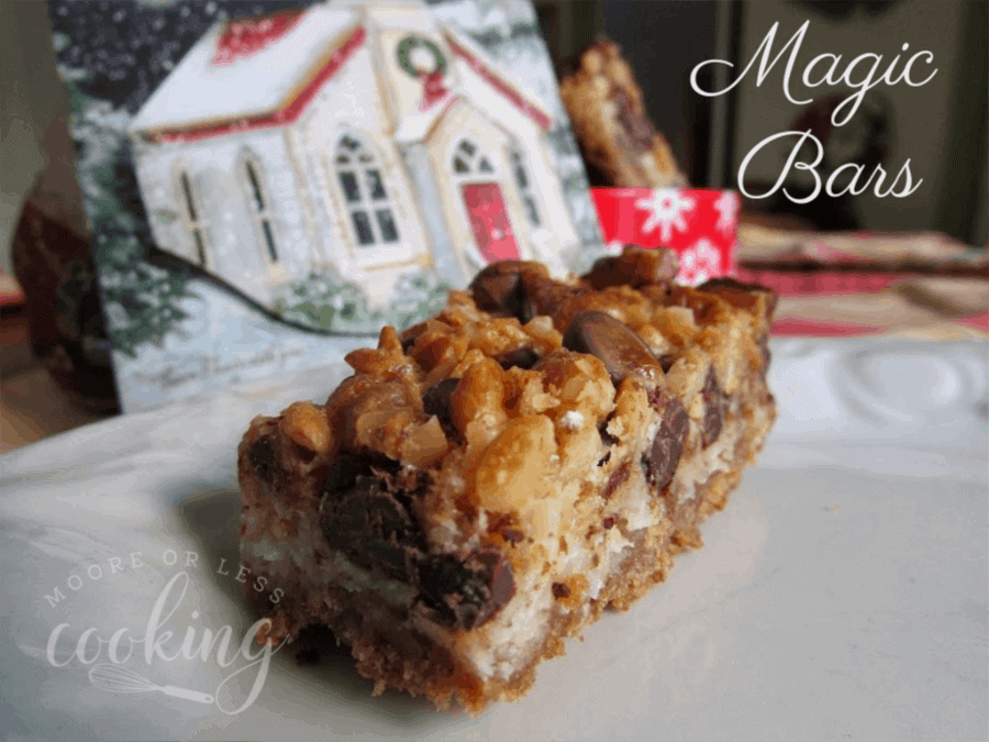 one magic bar in front of Christmas house and container of magic bars