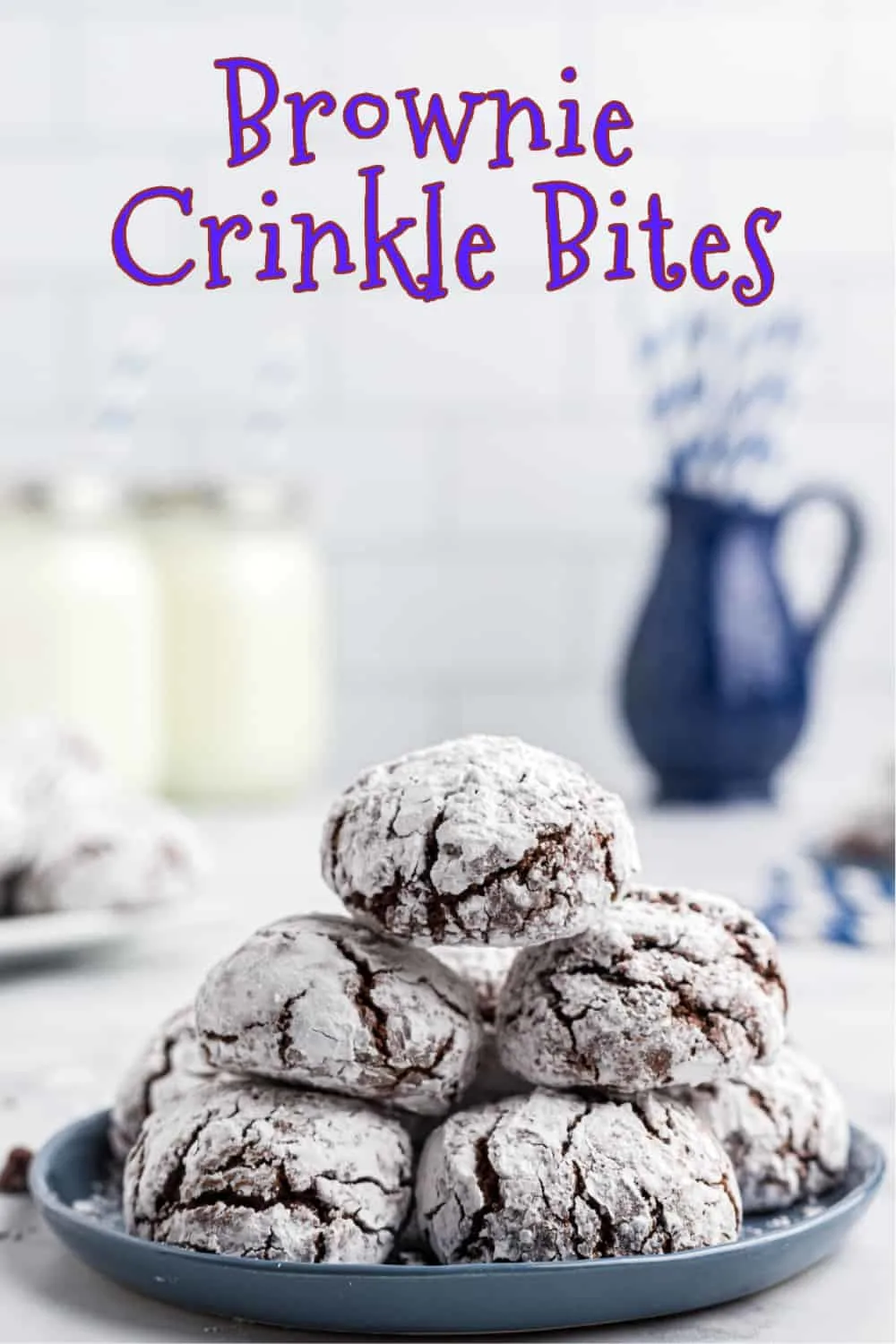 Fudgy, chocolate brownie crinkle bites are a decadent treat for the holidays. Part cookie and part brownie, these rich and chewy bites are rolled in powdered sugar to produce their iconic crinkle on top when baked. via @Mooreorlesscook