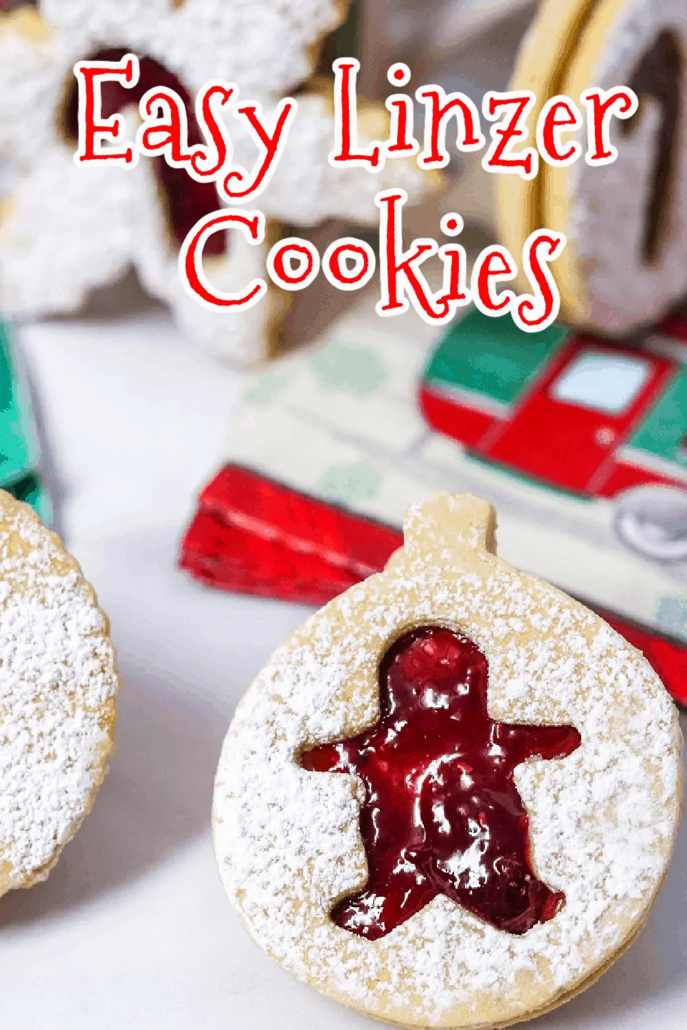 These buttery shortbread Linzer cookies are filled with raspberry jam that peeks through the cutout on top of each cookie. Dusted with powdered sugar, these sandwich cookies make the perfect holiday sweet treat. So easy to make with only a few ingredients! Get those cookie cutters out! via @Mooreorlesscook