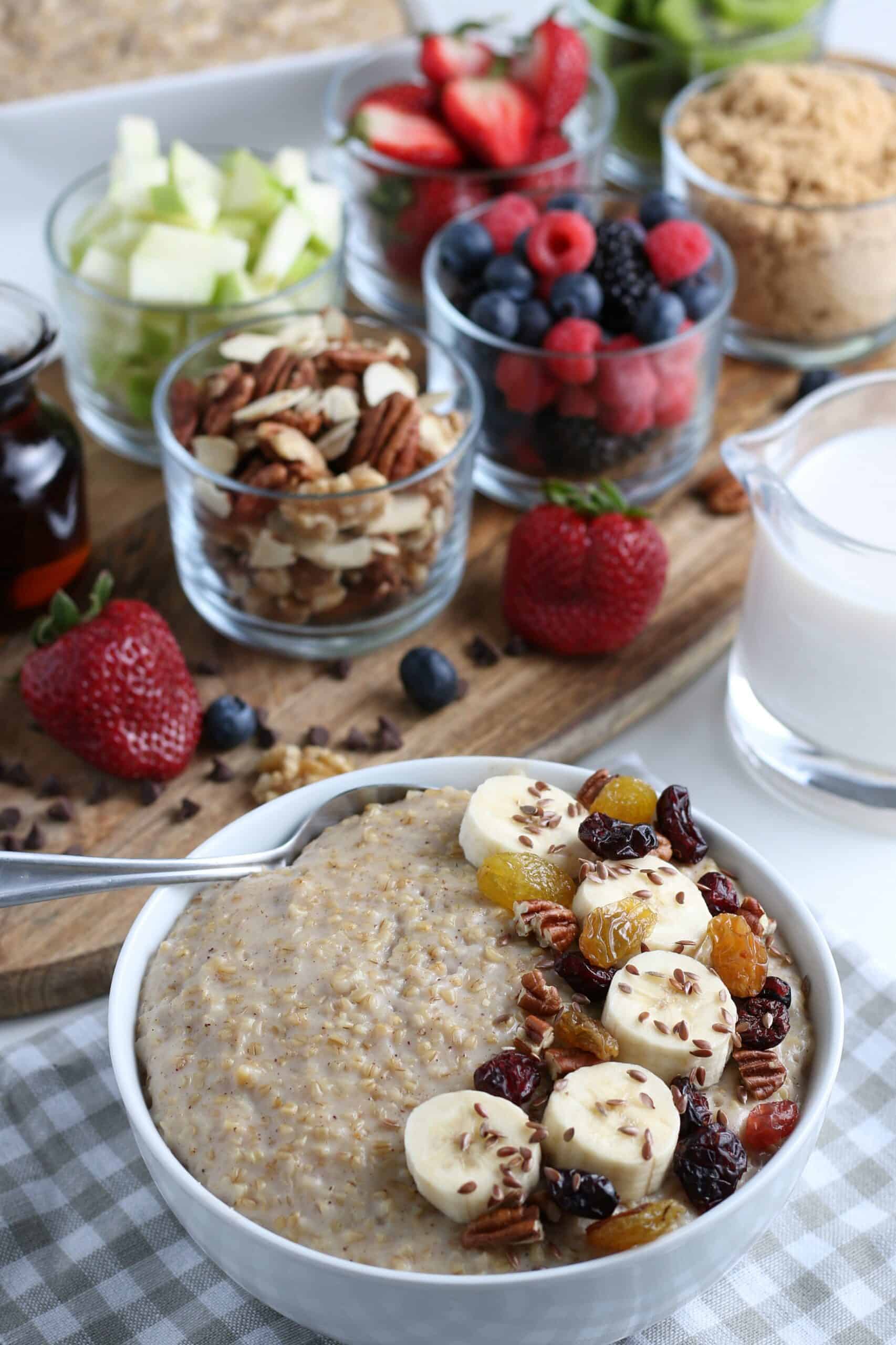 bowl oatmeal front with toppings, additional topping in background