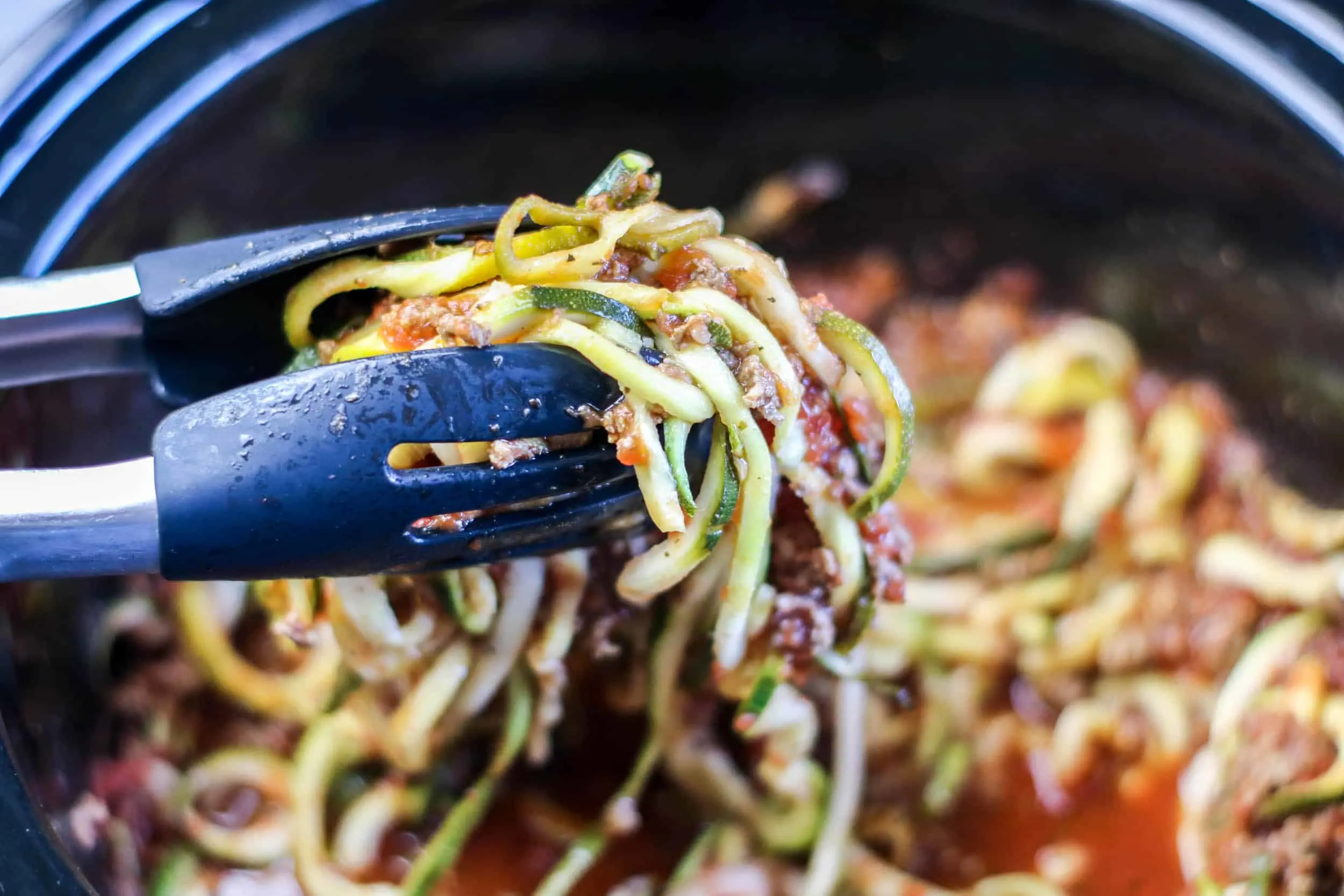 close up zoodles with meat sauce