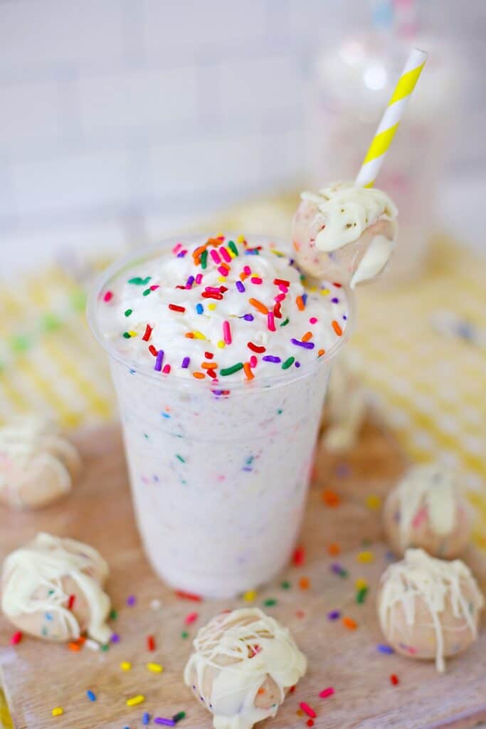 Hero shot Copycat Starbucks Birthday Cake Frappuccino topped with sprinkles and extra cake balls
