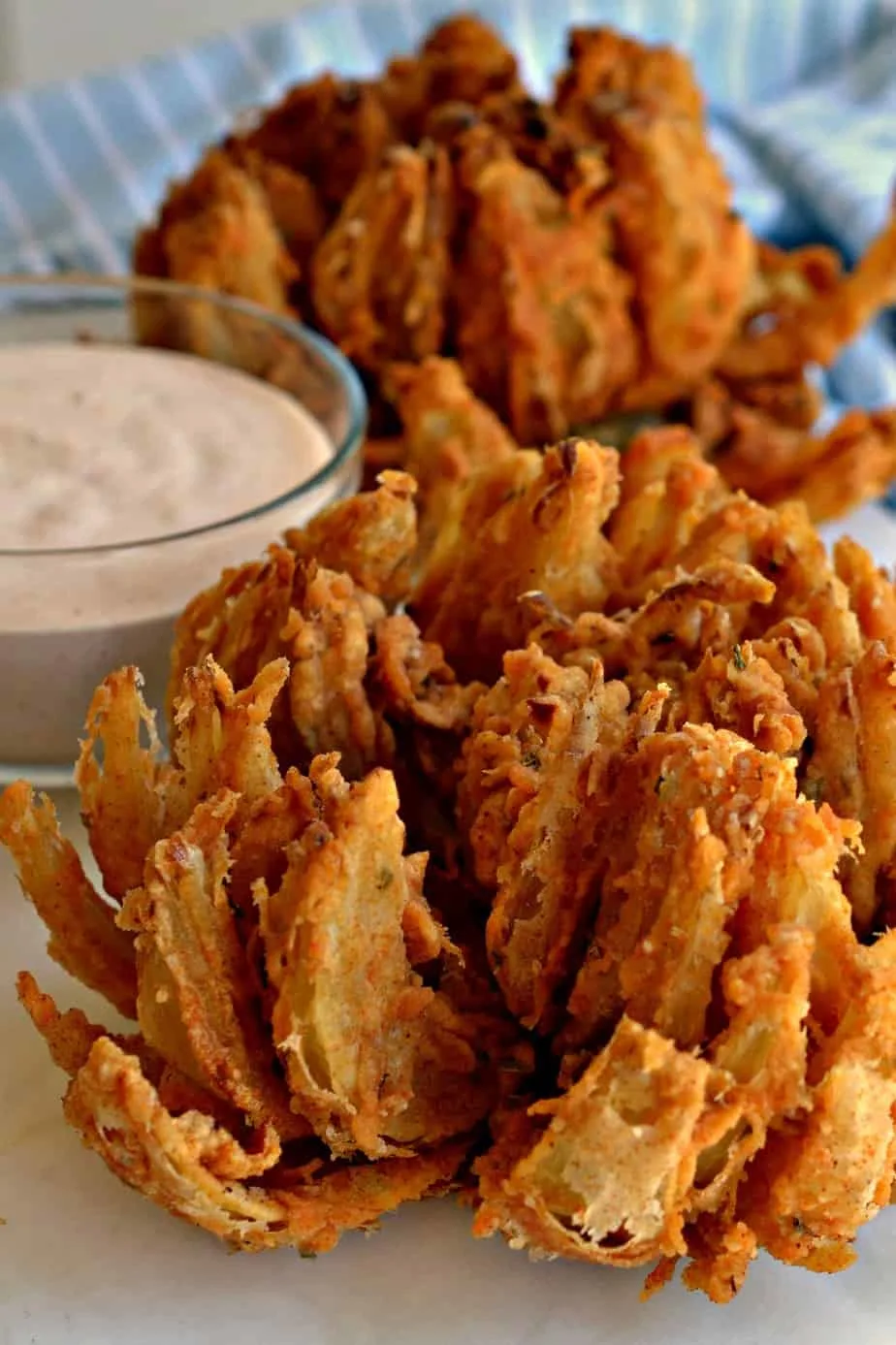 This drool-worthy appetizer that's a fan-favorite at many restaurants can be made right at home, thanks to this easy recipe. I'll show you how to cut the onion into a "bloom," how to easily coat it in batter and how to deep fry it. It's easier than you think and once you do it, your family will be requesting it regularly! via @Mooreorlesscook