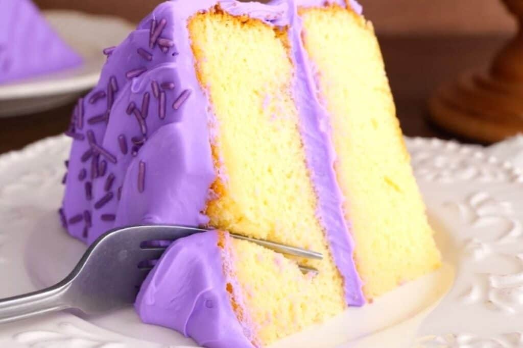 Yellow cake with purple frosting