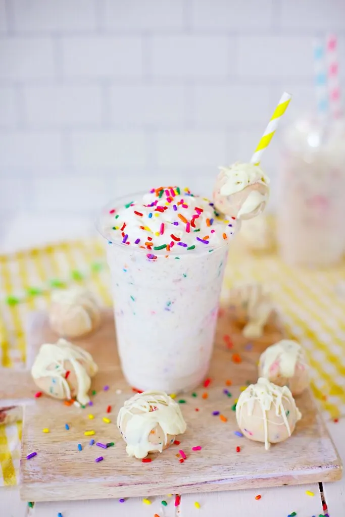Copycat Starbucks Birthday Cake Frappuccino frosty beverage with a striped yellow straw ready to drink
