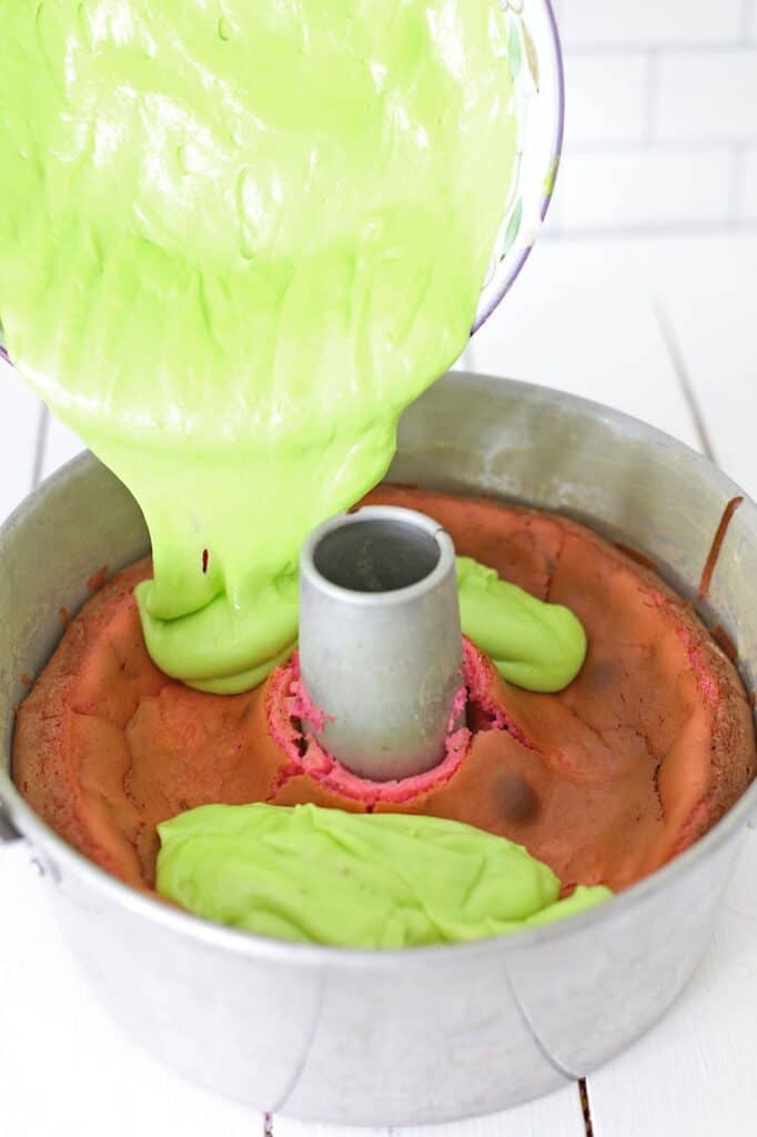 Remove the Key Lime Cake Batter from the refrigerator, and let it set at room temperature while the Cheesecake cools.  
After 30 minutes, pour the green Cake Batter on top of the Cheesecake, and place the pan back in the oven.
