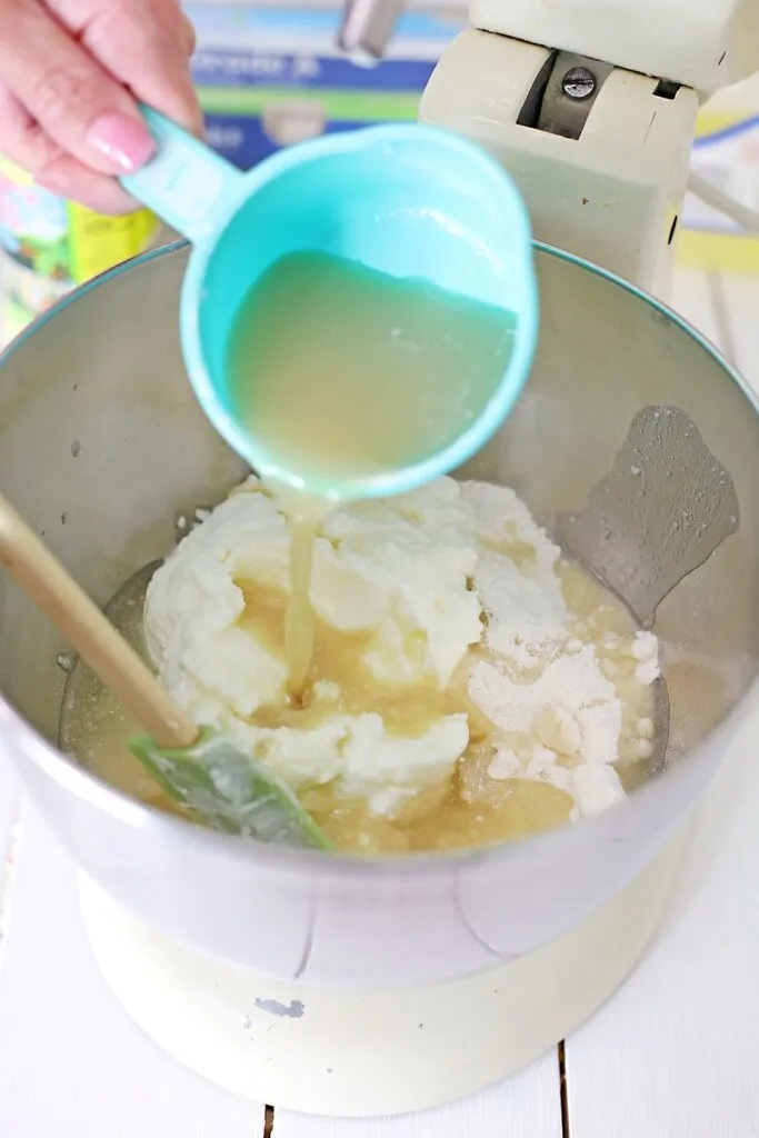 Key Lime Juice being added to the In the mixing bowl of a stand mixer, add the Cake mix, Yogurt, and Key Lime Juice, and mix on low just until blended.  
