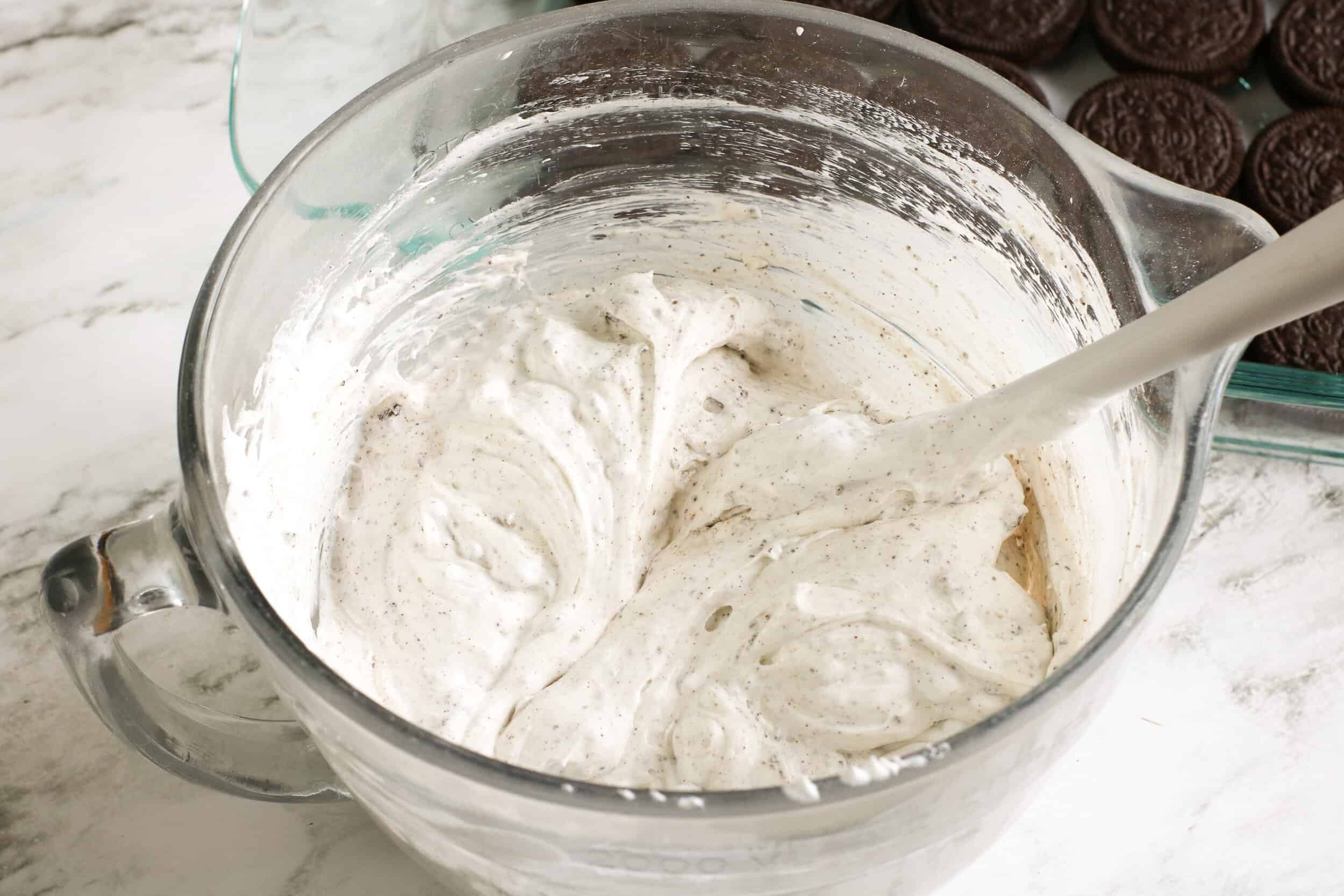 in a bowl stir in crushed cookie and cool whip until blended
