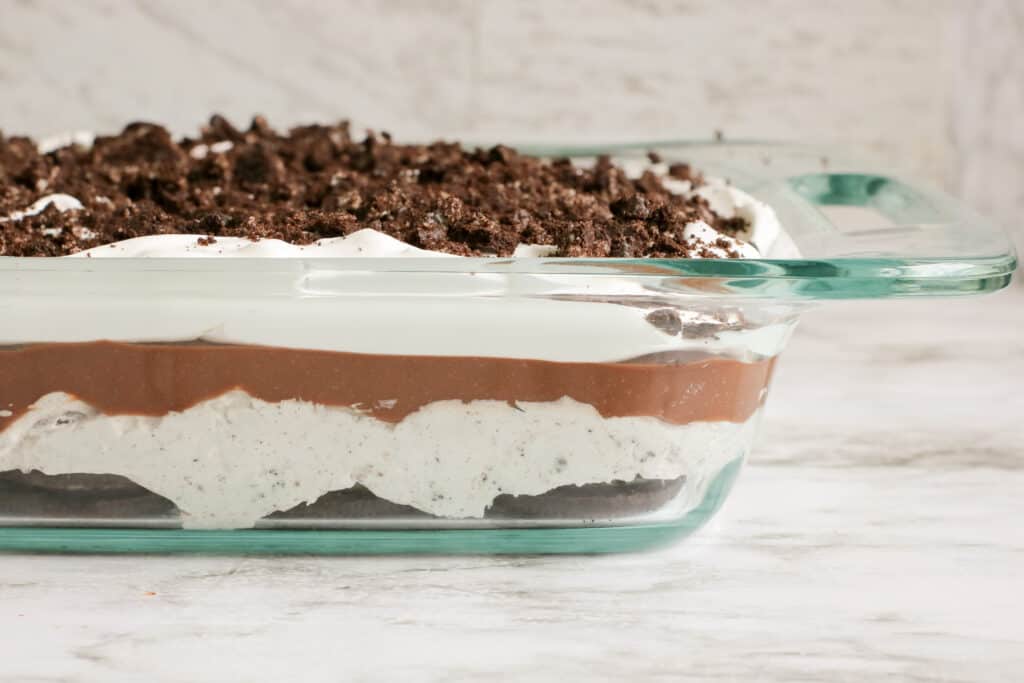 simple to make no bake oreo cookie delight dessert side view, you can see the 5 layers of this dessert