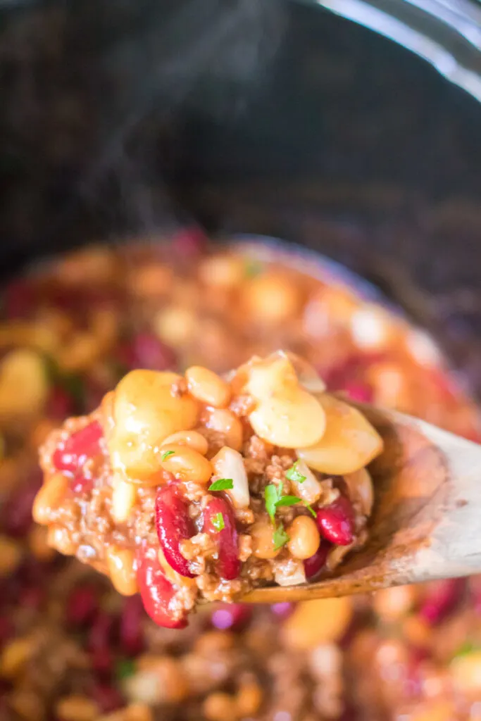 close up of beefy beans on a spoon steamy hot