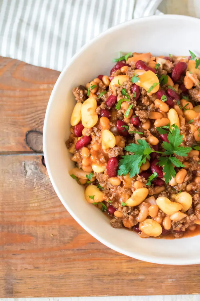 Big bowl filled with delicious slow cooker beefy baked beans