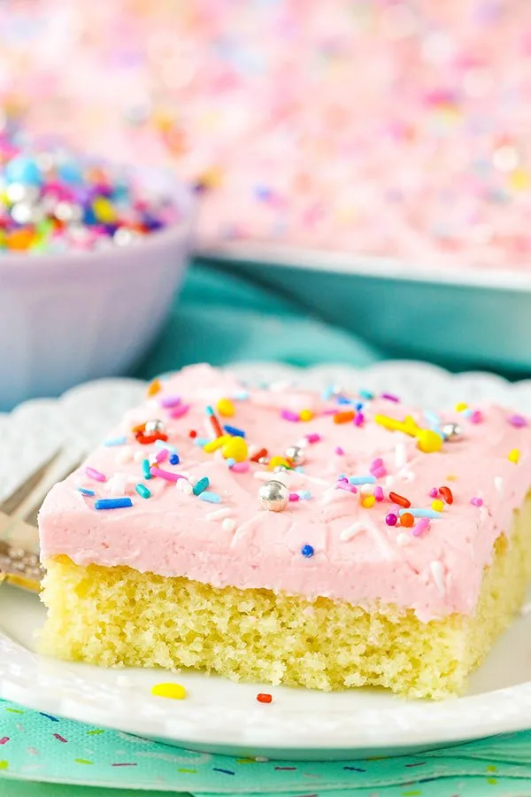slice of vanilla sheet cake with pink frosting