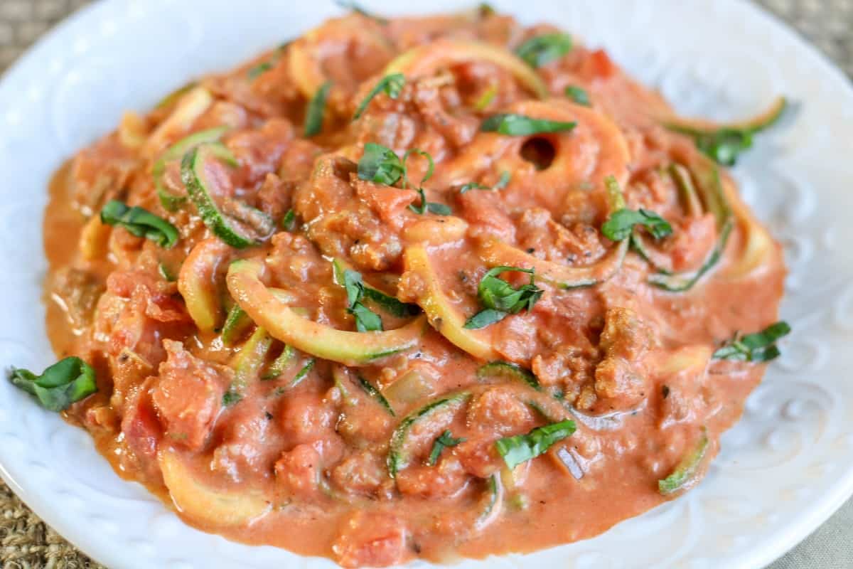 Creamy Tomato Sauce with Italian Sausage over Zoodles Moore or Less