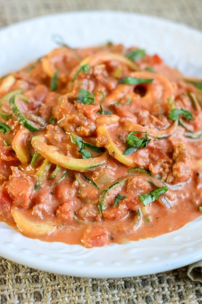 zesty sausage and creamy tomato sauce over spiralized zoodles