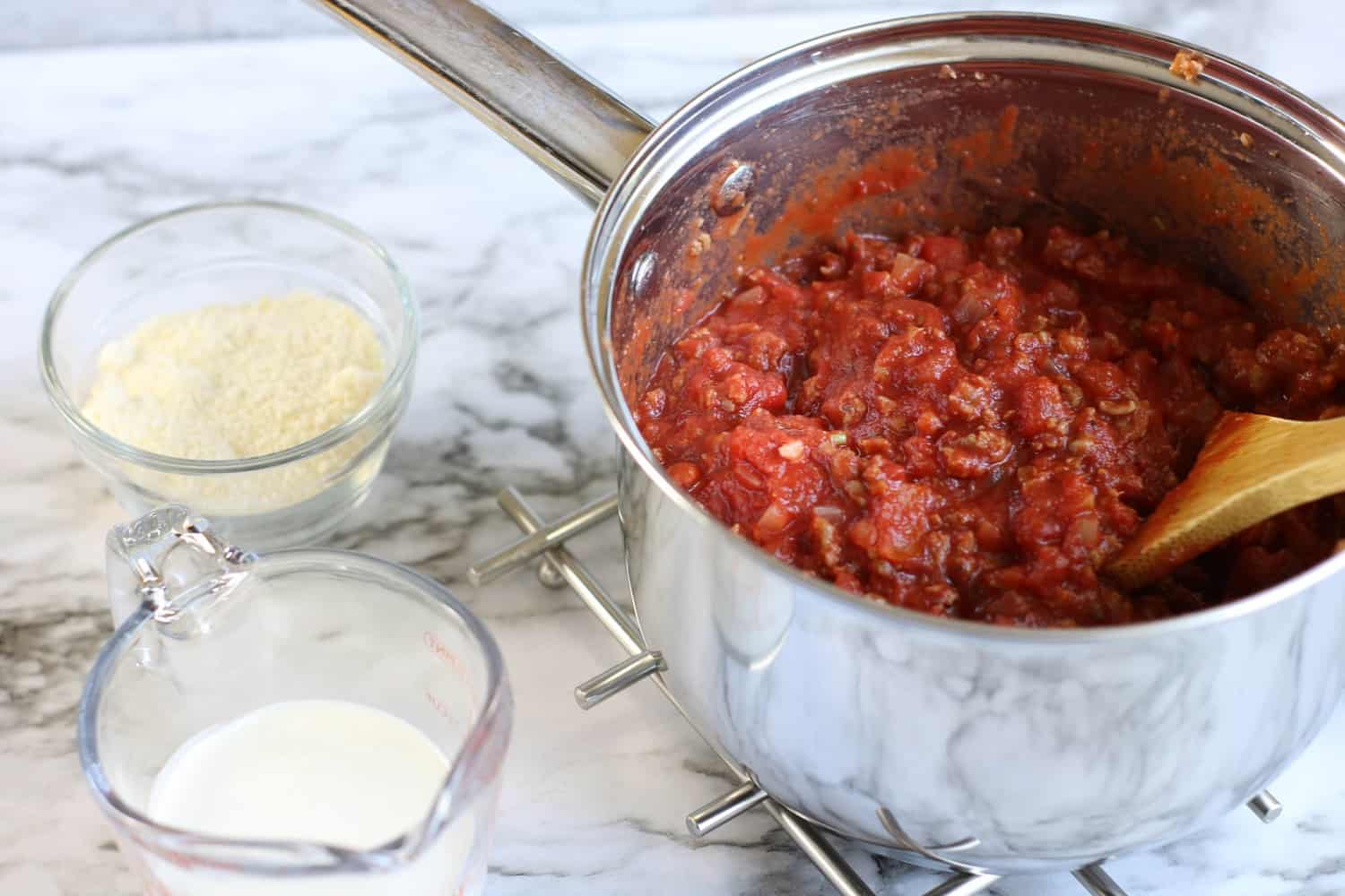 Creamy Tomato Sauce with Italian Sausage over Zoodles Moore or Less