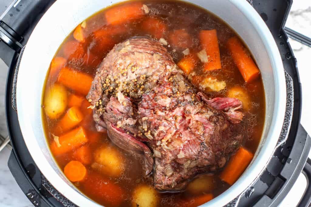 Cooked corned beef, carrots and potatoes in Ninja with broth