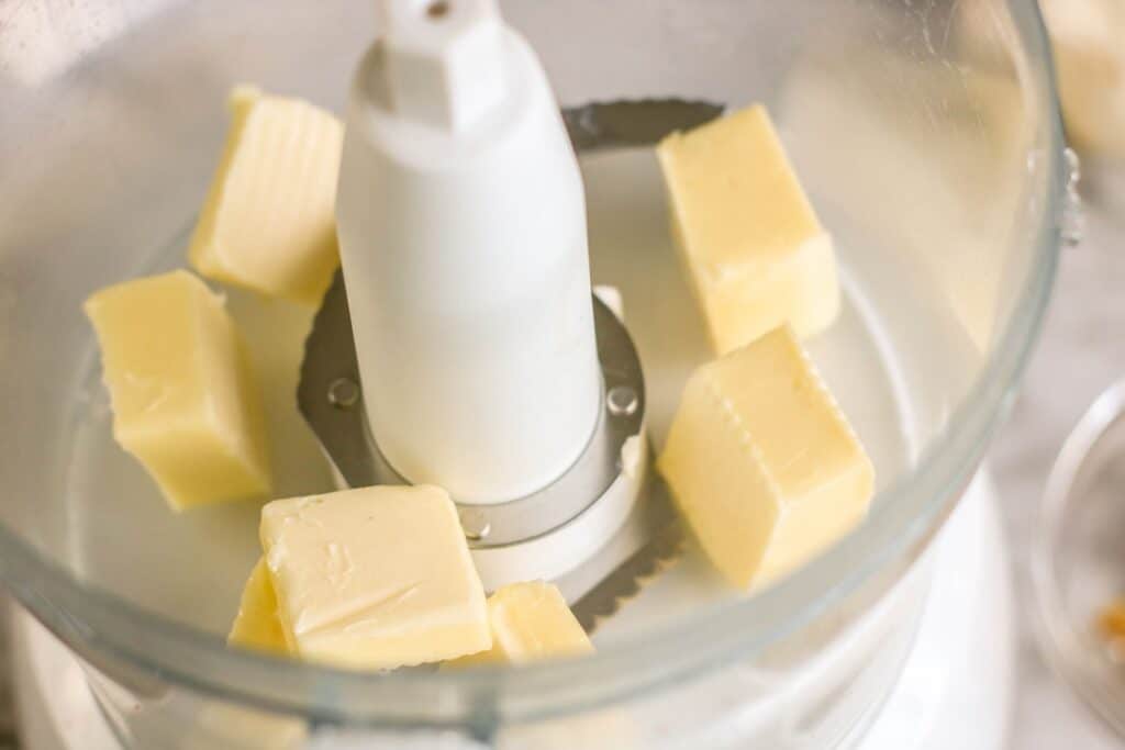 1 stick of unsalted butter cut into tablespoons in a cuisinart blender top open