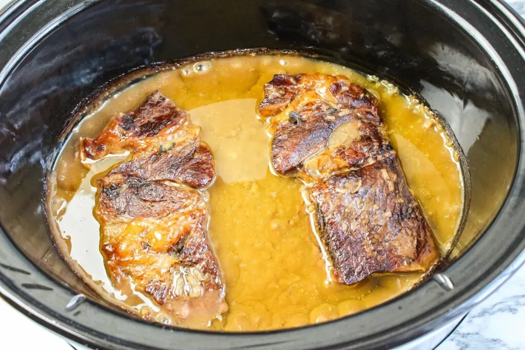 slow cooker roast beef and gravy cooked in slow cooker for eight hours