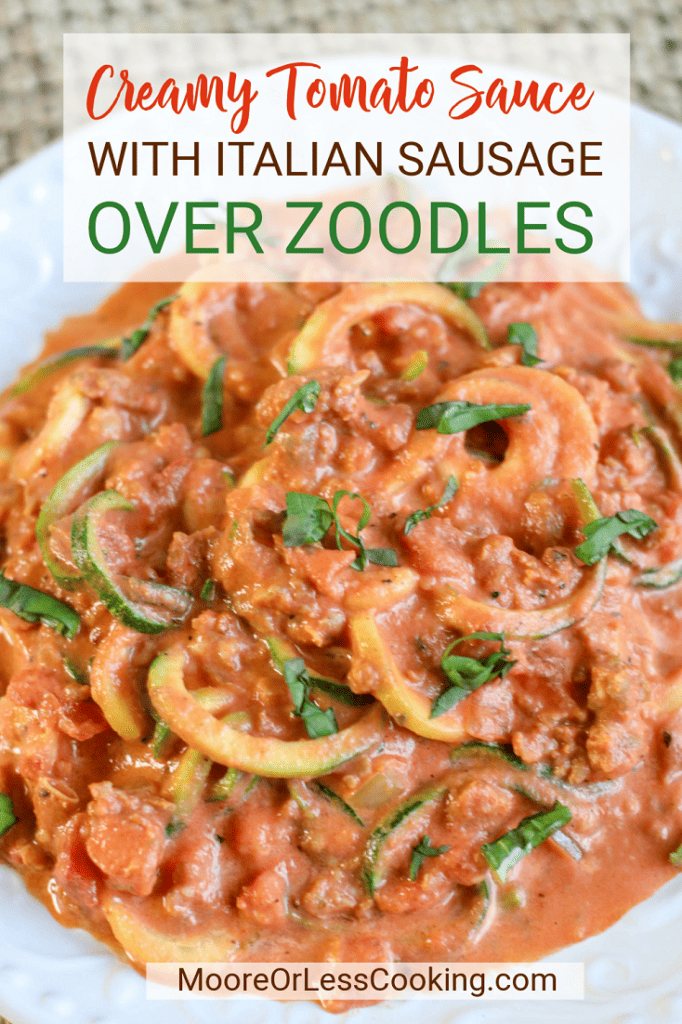 pin creamy tomato sauce with Italian sausage over zoodles