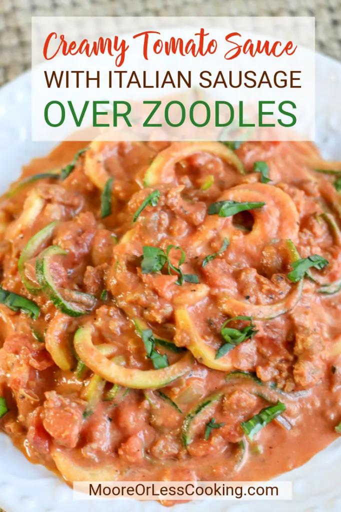 pin creamy tomato sauce with Italian sausage over zoodles