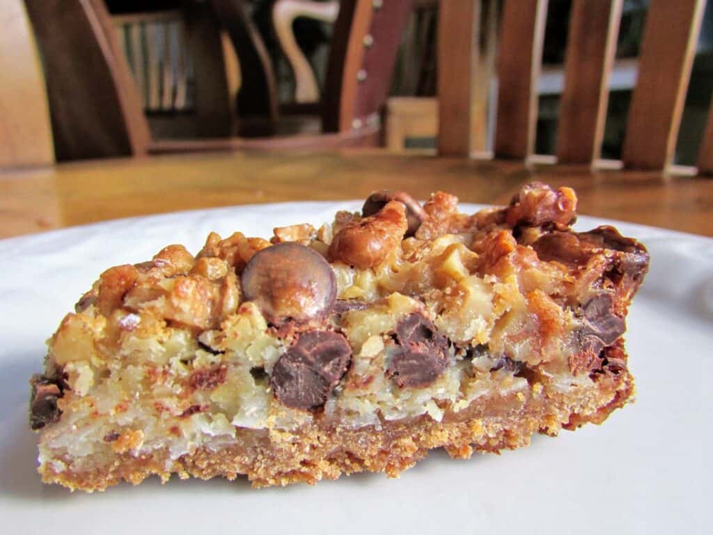 7 ingredient magical magic bars on a white plate