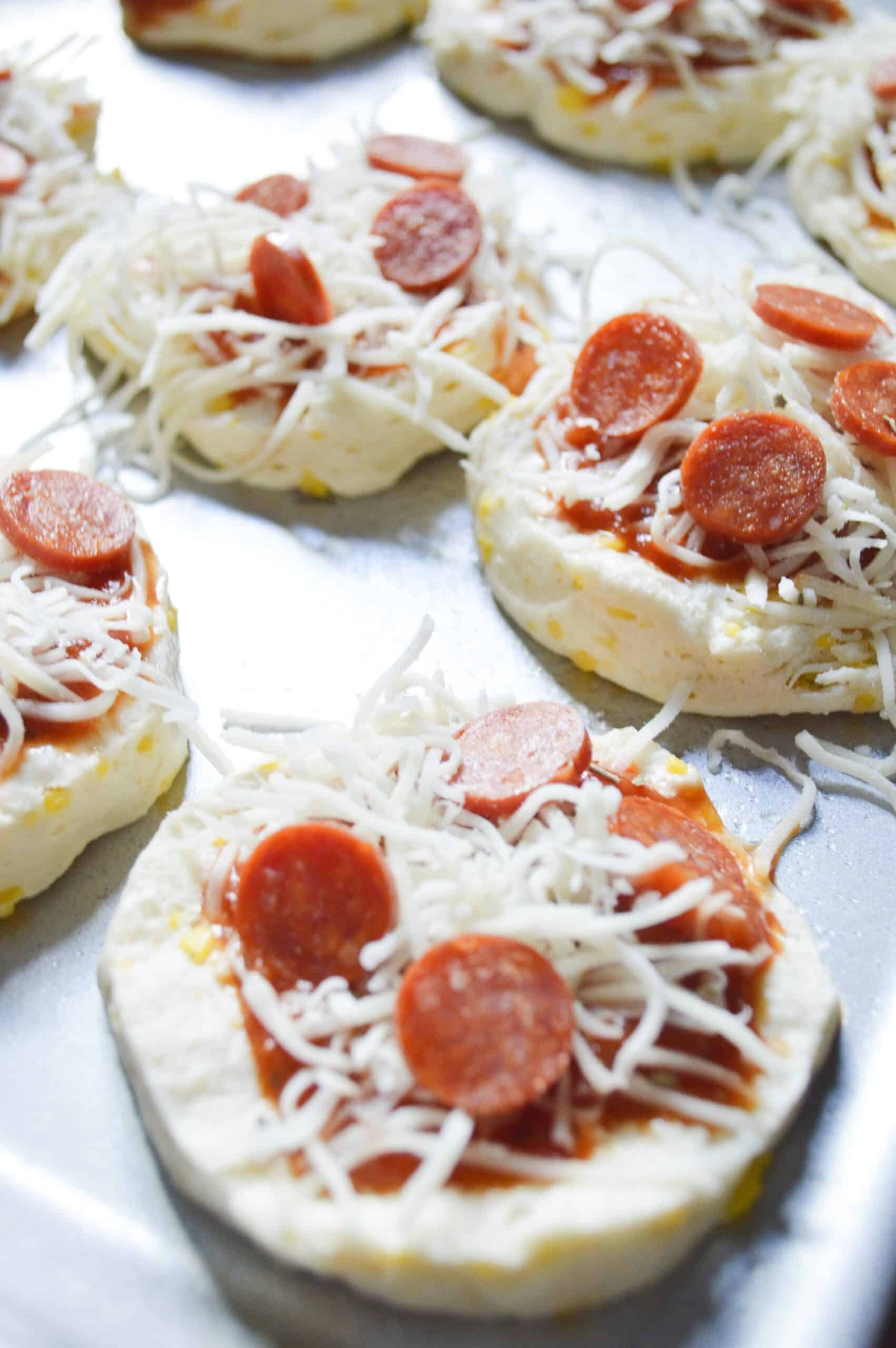Mini Pizzas sprinkle cheese and mini Pepperoni