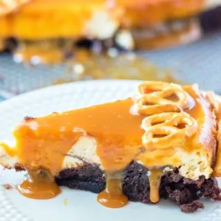 slice of brownie bottom salted cheesecake caramel dripping