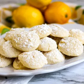 lemon cookies horizontal on platter lemons