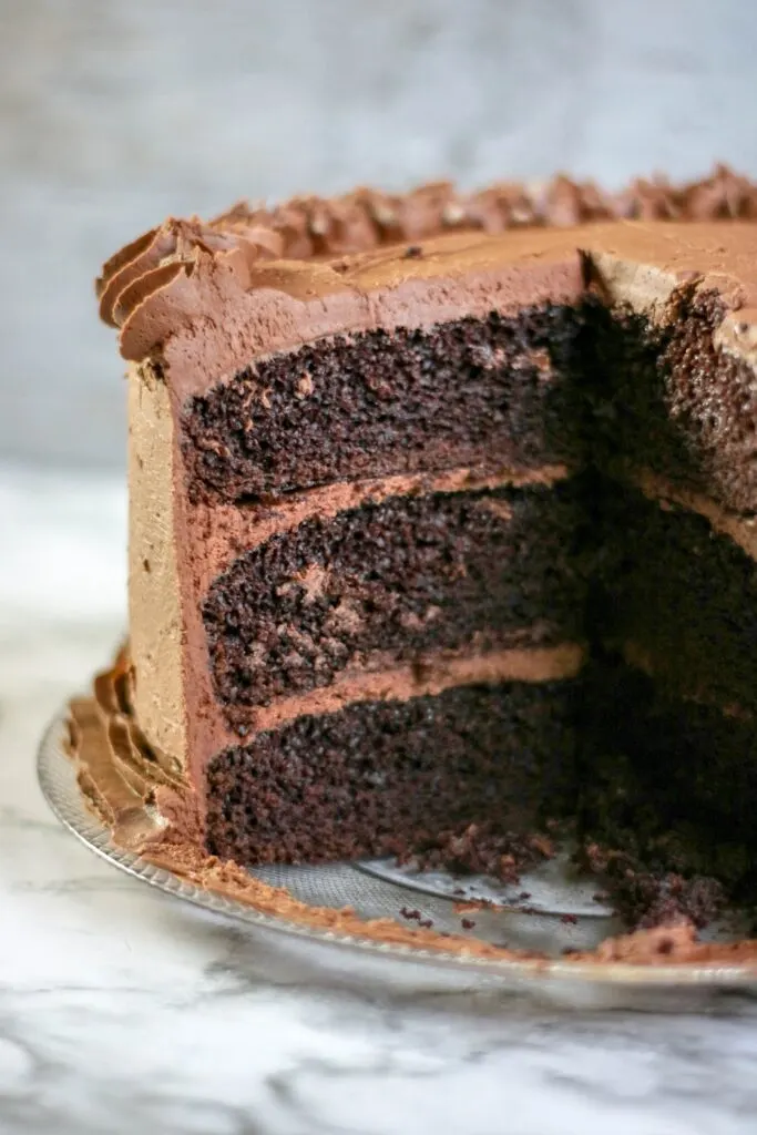 cut open Chocolate cake with Chocolate buttercream frosting