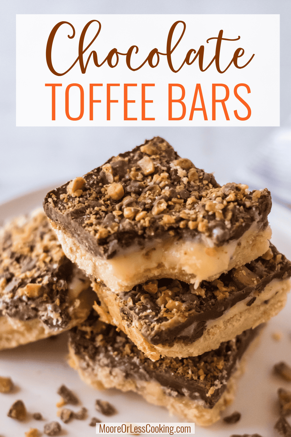 These Chocolate Toffee Bars are a delectable treat with a shortbread crust topped with a gooey and buttery sweet filling that holds a layer of toffee-crusted chocolate for the perfect finish. These triple-layered bars are perfect for any holiday - winter, spring, summer or fall! via @Mooreorlesscook