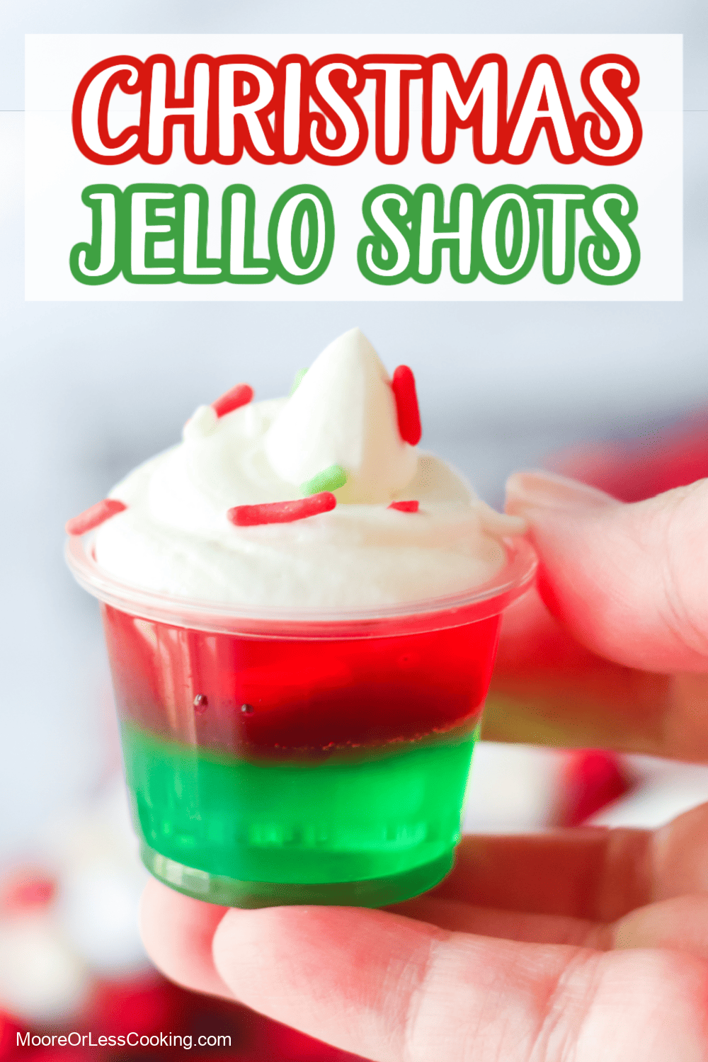 Fruity, festive, and spiked with vodka, these red and green layered Christmas Jello shots are topped with whipped cream and sprinkles for a seasonal twist on basic jello shots. They're perfect for holiday parties! via @Mooreorlesscook