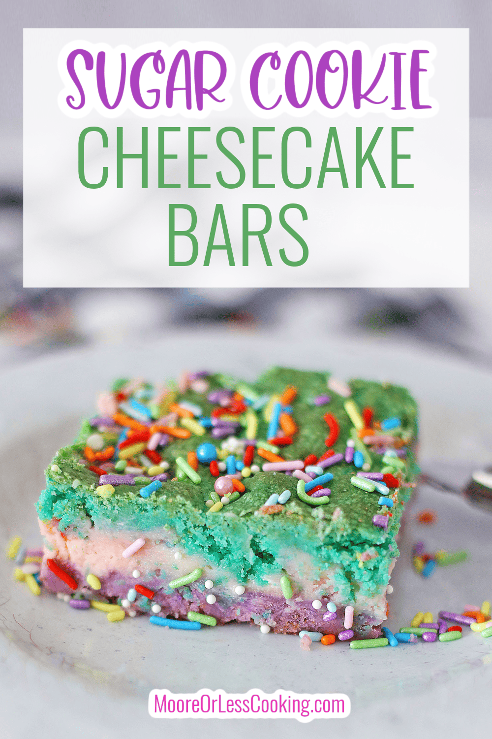 These Sugar Cookie Cheesecake Bars are a delightful 3 layer dessert that sandwiches a sweet cheesecake filling between two brightly colored cookie dough layers. Top it off with fun sprinkles for a dessert that's perfect for holidays and parties. via @Mooreorlesscook