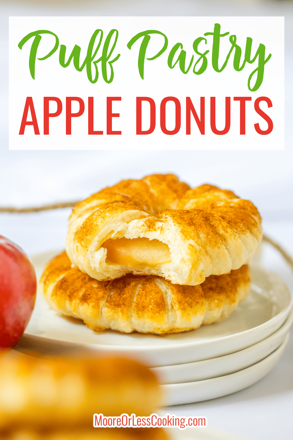 Sliced apple rings wrapped in a flaky crust and dusted with sweet and fragrant cinnamon sugar make these Puff Pastry Apple Donuts the perfect cozy fall treat. Quick and easy to assemble, these baked donuts taste just like apple pie! via @Mooreorlesscook