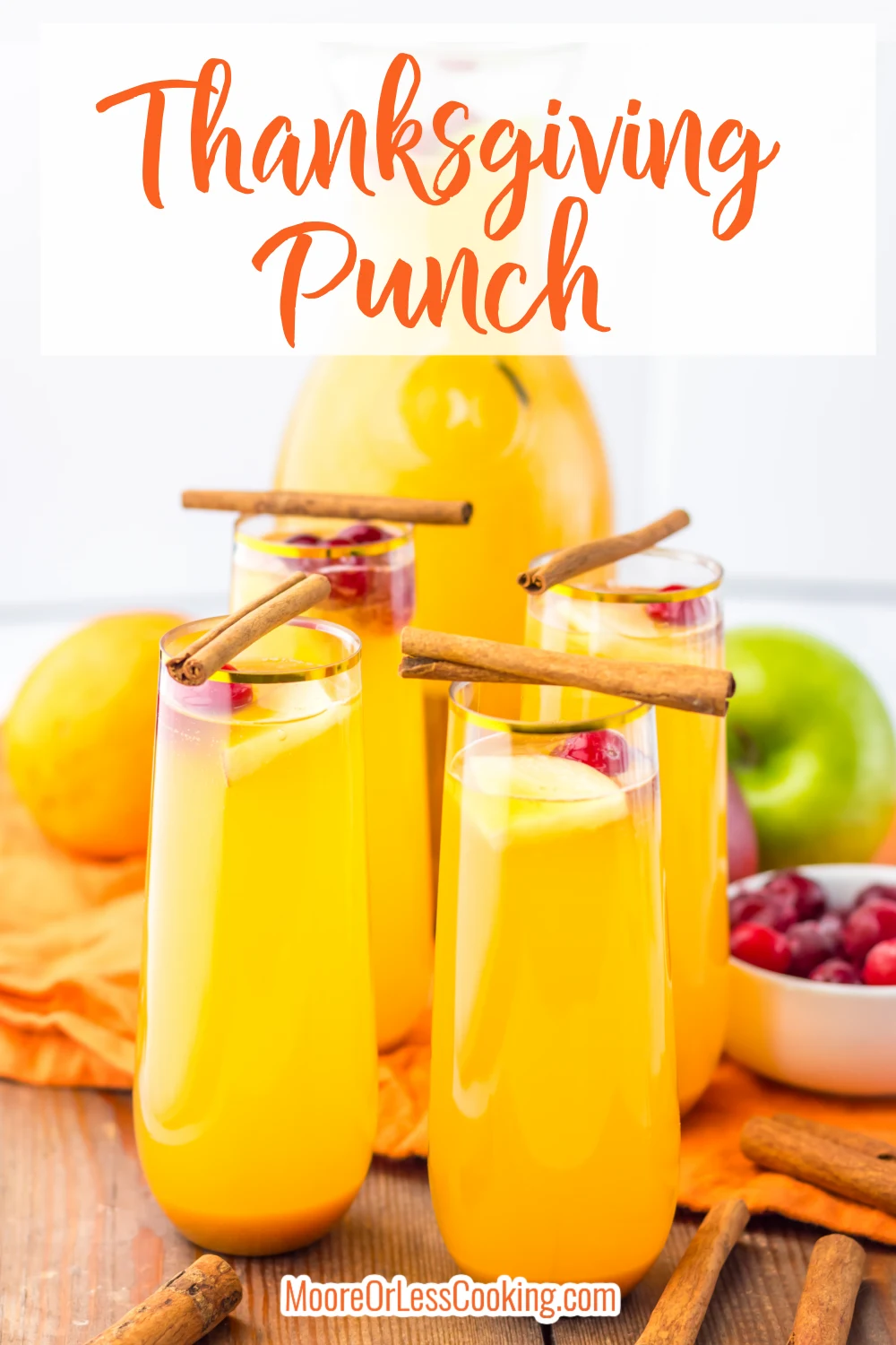 This Thanksgiving Punch is a delicious fall drink perfect for your Thanksgiving dinner or anytime during the fall. A delicious punch combines apple cider, Ginger Ale and orange juice. Cinnamon sticks, cranberries and apple and orange slices add to the delicious flavor of this punch. It is a light drink that everyone loves. Make it more of an adult drink by adding a little rum. via @Mooreorlesscook