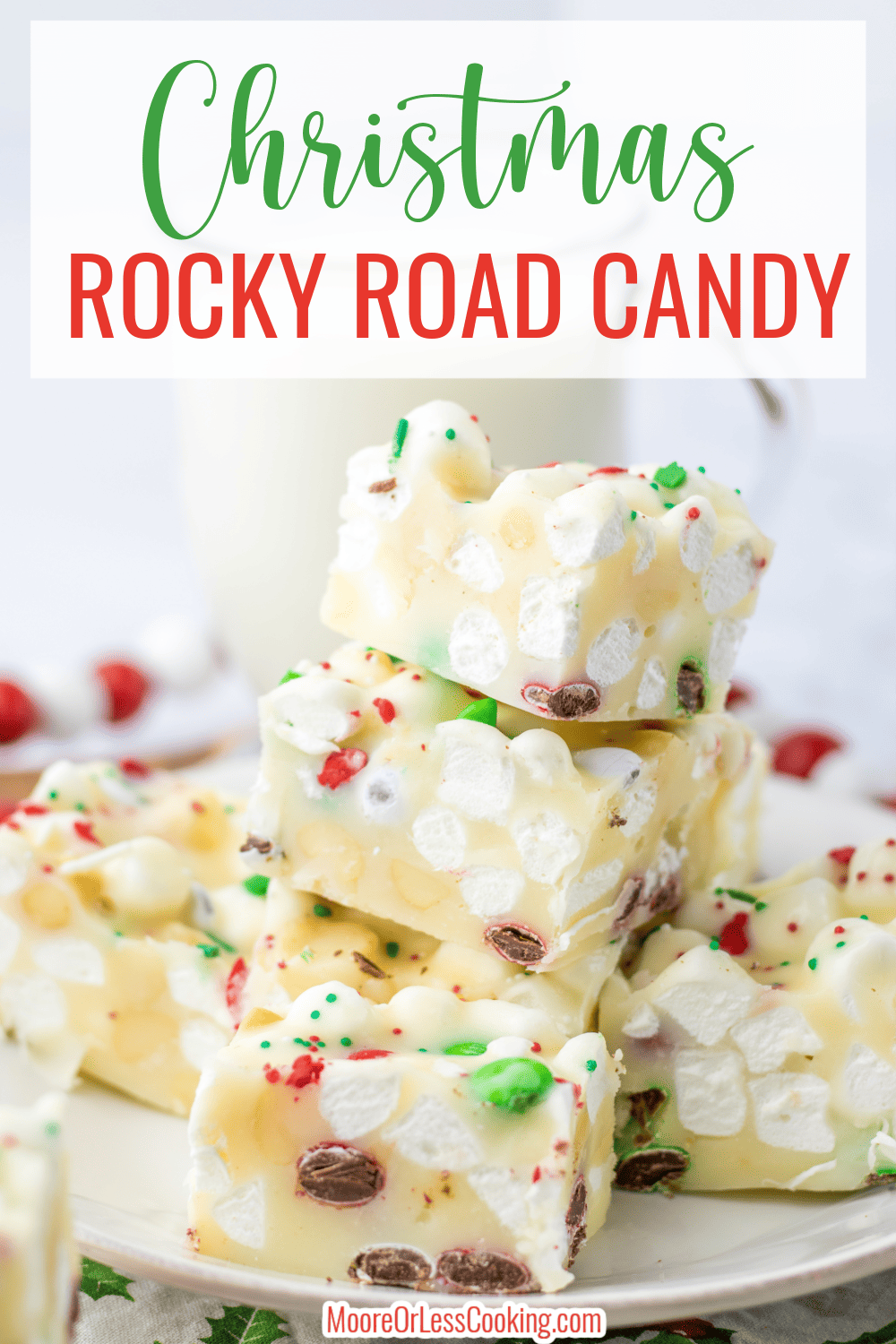 Christmas Rocky Road Candy- white chocolate combined with butter and peppermint extract to create a creamy base for mini marshmallows, candies, and macadamia nuts.  A perfect Christmas treat to serve at parties or give away as gifts.  via @Mooreorlesscook