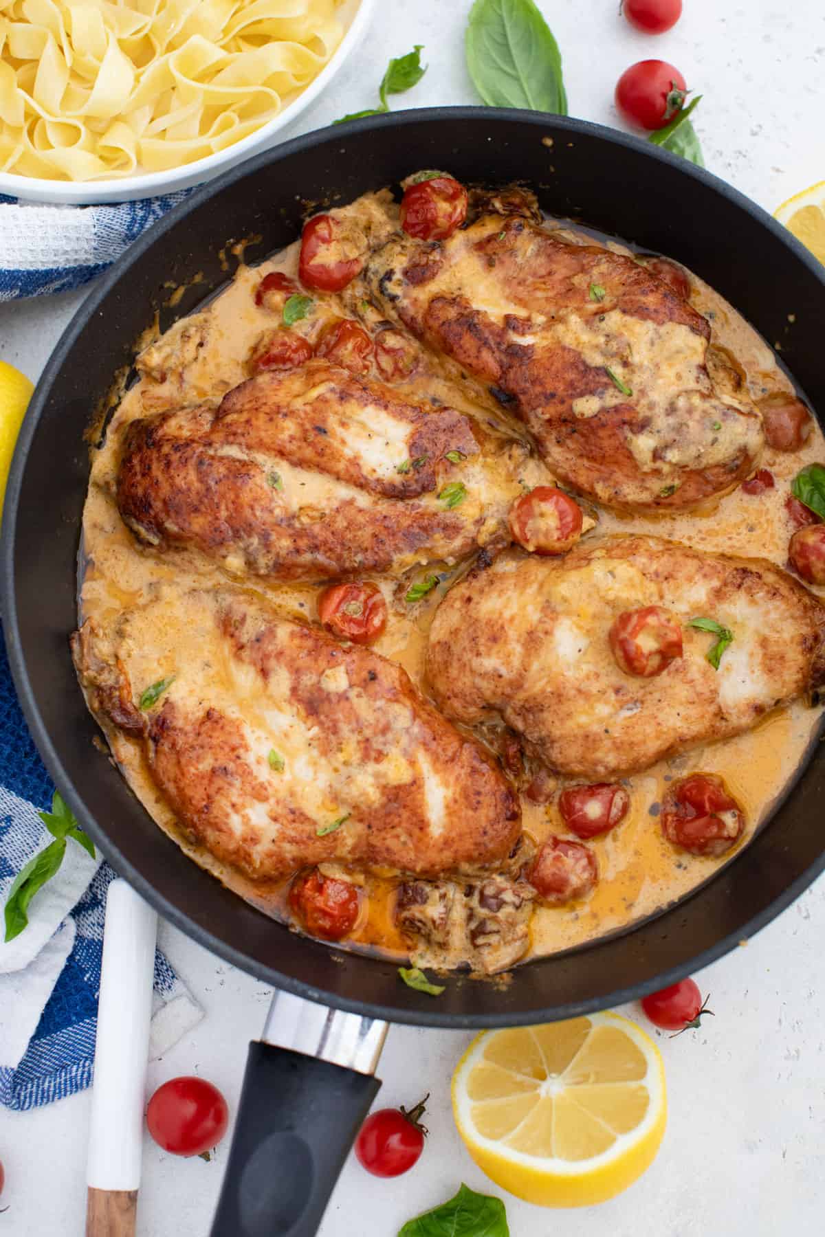 chicken cooking in the cast iron skillet