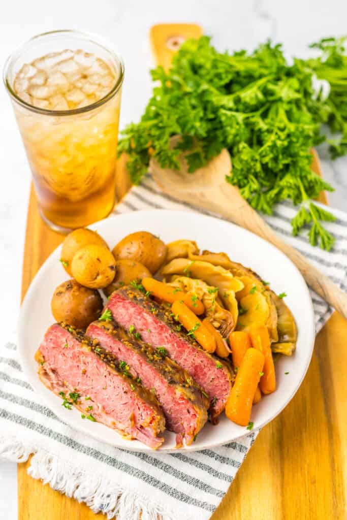 corned beef dinner on plate with iced tea