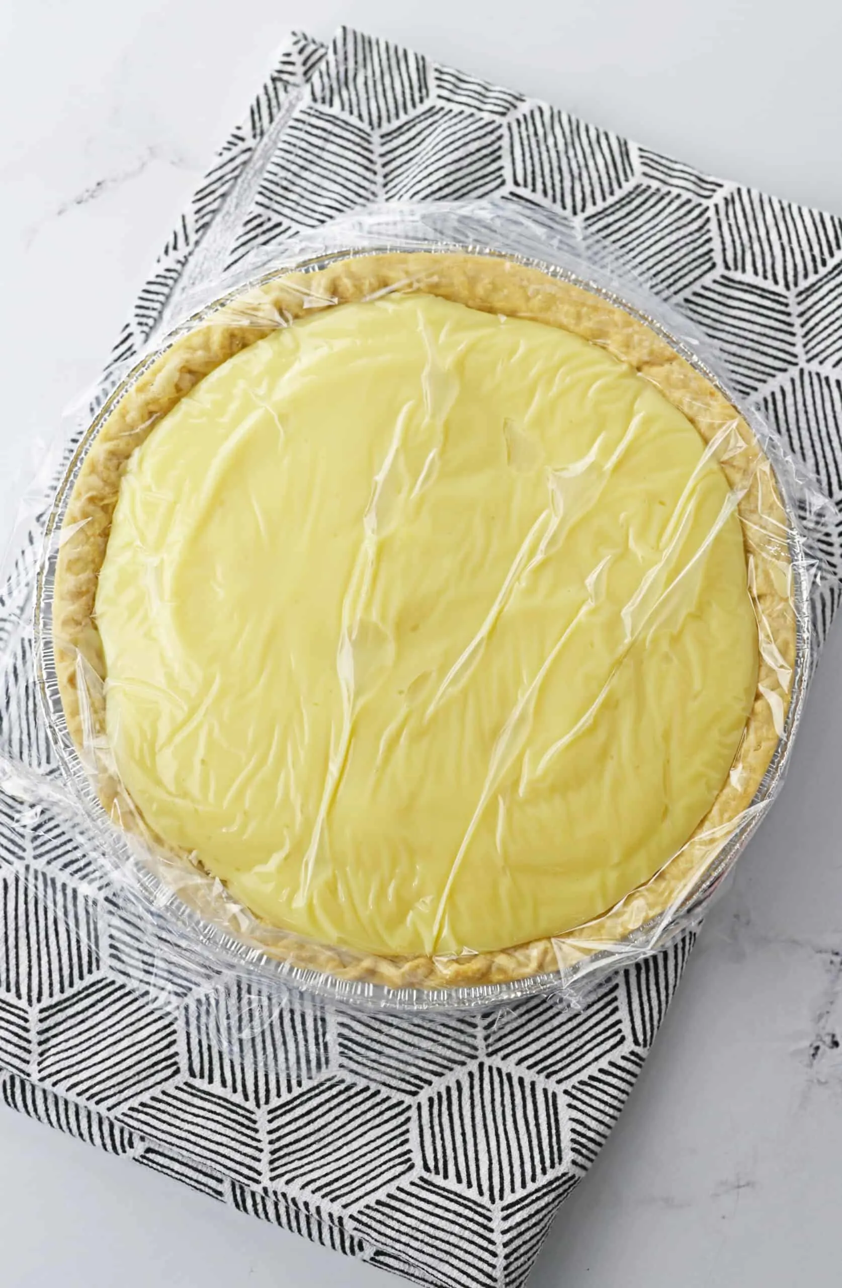 Banana Cream Pie wrapped place in refrigerator